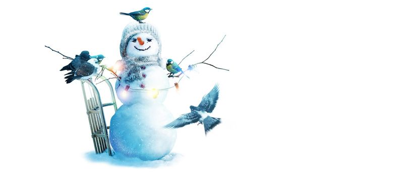 Happy snowman standing in winter christmas landscape.
