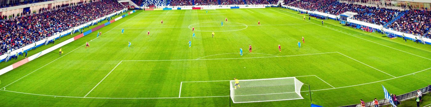 Football stadium, shiny lights, view from field. Soccer concept