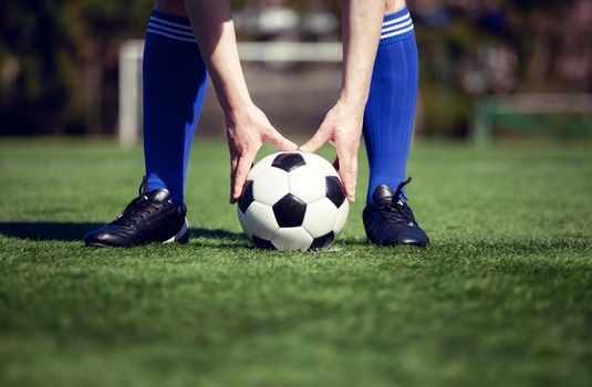 Traditional soccer game with a leather ball