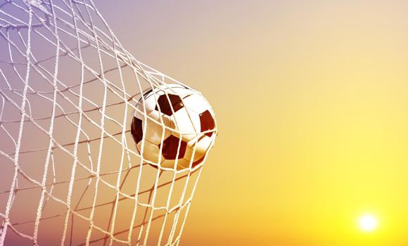 Traditional soccer game with a leather ball