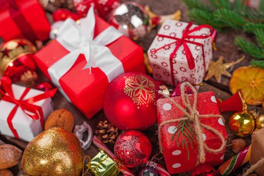 Gift box in wrapping paper with satin ribbon. Merry Christmas holiday concept.