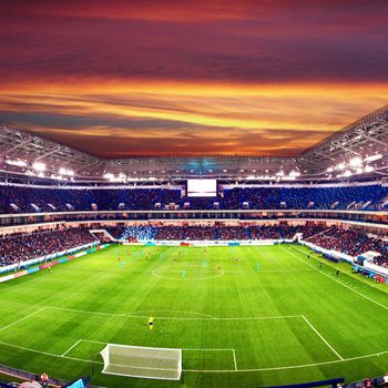 Football stadium, shiny lights, view from field. Soccer concept