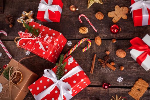 Gift box in wrapping paper with satin ribbon. Merry Christmas holiday concept.
