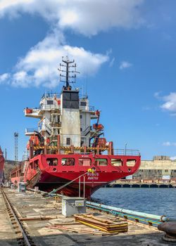 Chernomorsk, Ukraine. 21.03.2021. Big ship at the pier in the Chernomorsk Shipyard on a sunny spring day