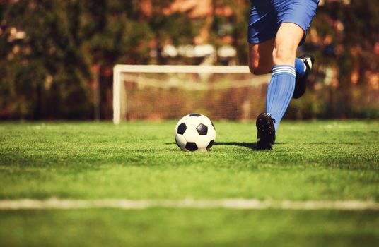 Traditional soccer game with a leather ball