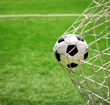 Traditional soccer game with a leather ball