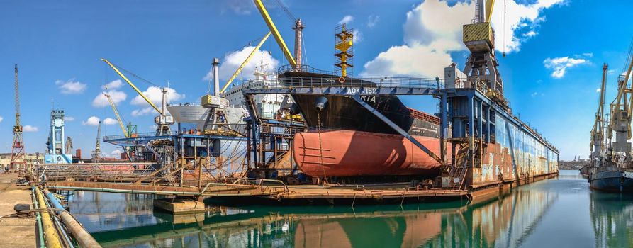 Chernomorsk, Ukraine. 21.03.2021. Large ship in dry dock of the Chernomorsk Shipyard on a sunny spring day