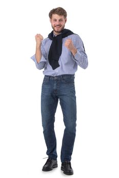 Excited man holding fists as achieving success. Positive emotions celebrating victory as a winner isolated over white background.