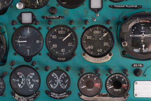 Toggle switches old soviet helicopter mi2 many text on Russian language which translates Light danger Beacon Suspension Cargo Dump Tactical Emergency