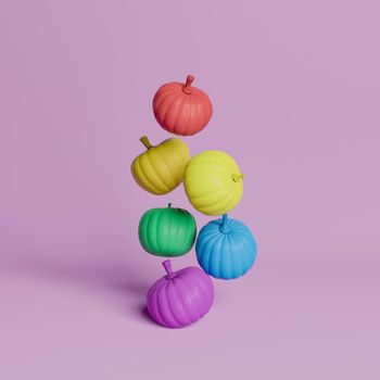 pumpkins floating in the air with colors of LGBTQ flag on pastel pink background. minimal concept of Halloween, autumn and inclusion. 3d rendering