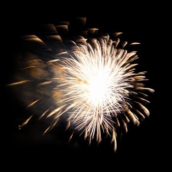 Colorful celebration fireworks isolated on a black sky background.