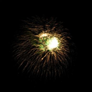 Colorful celebration fireworks isolated on a black sky background.