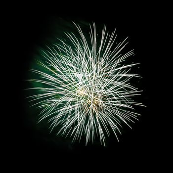 Colorful celebration fireworks isolated on a black sky background.