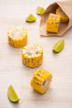 Delicious tasty grilled corn on wooden table