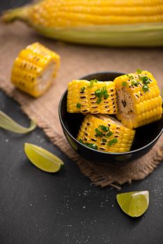 Tasty sweet grilled corn with onion sauce