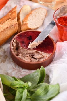 Delicate chicken pate with pureed cranberries, drenched in jelly. Served with pieces of baguette and fruit drink