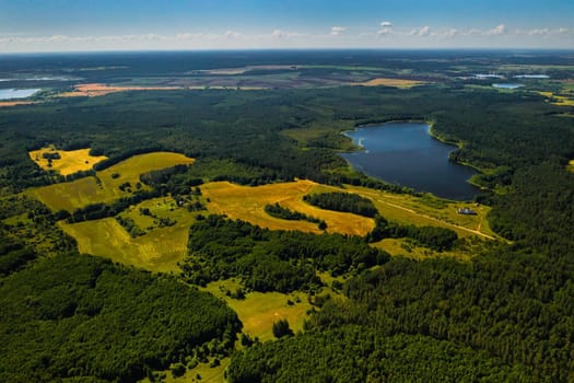 Top view of Bolta lake in the forest in the Braslav lakes National Park at dawn, the most beautiful places in Belarus.An island in the lake.Belarus