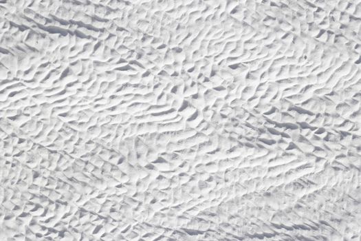 Abstract texture of gray-white calcium deposit on surface stone. Pamukkale travertine surface in Turkey