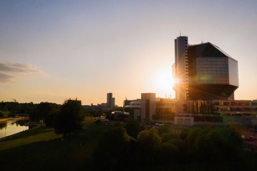 Top view of the National library and a new neighborhood with a Park in Minsk-the capital of the Republic of Belarus at sunset, a public building.