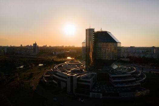 Top view of the National library and a new neighborhood with a Park in Minsk-the capital of the Republic of Belarus at sunset, a public building.