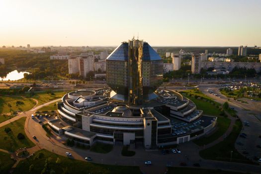 Top view of the National library and a new neighborhood with a Park in Minsk-the capital of the Republic of Belarus at sunset, a public building.
