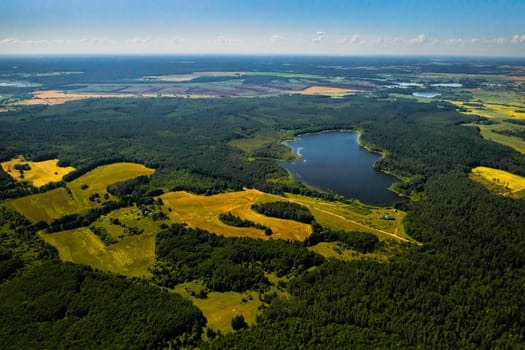 Top view of Bolta lake in the forest in the Braslav lakes National Park at dawn, the most beautiful places in Belarus.An island in the lake.Belarus