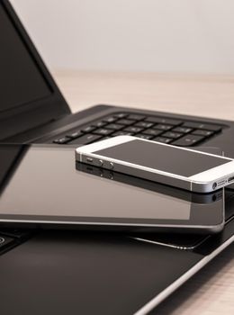 Modern electronic devices - laptop, tablet and telephone