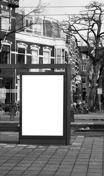 Blank billboard on a roadside in european town