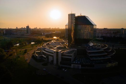 Top view of the National library and a new neighborhood with a Park in Minsk-the capital of the Republic of Belarus at sunset, a public building.