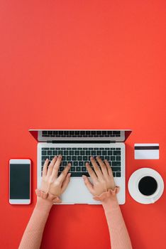 Woman typing on computer keyboard selective focus on hand, can be used for e-commerce, business, technology and internet concept