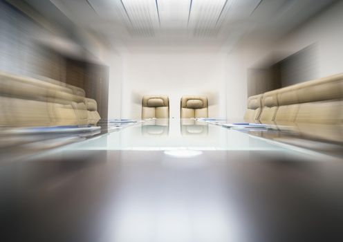 conference room with wooden table and beige leather armchairs