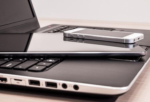 Modern electronic devices - laptop, tablet and telephone