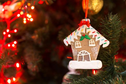 Christmas tree decoration with gingerbread of house