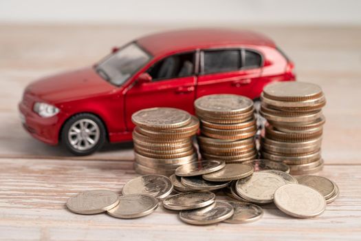 Car on coins background; Car loan, Finance, saving money, insurance and leasing time concepts.