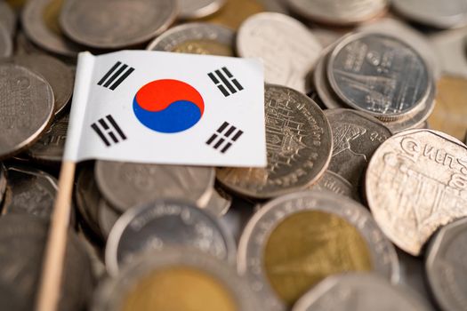 Stack of coins with Korea flag on white background. flag on white background.