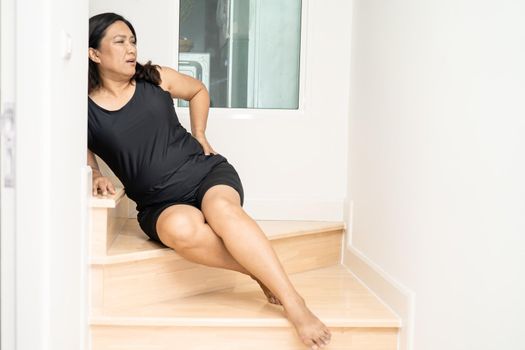 Asian middle-aged lady woman patient fall down the stairs because slippery surfaces