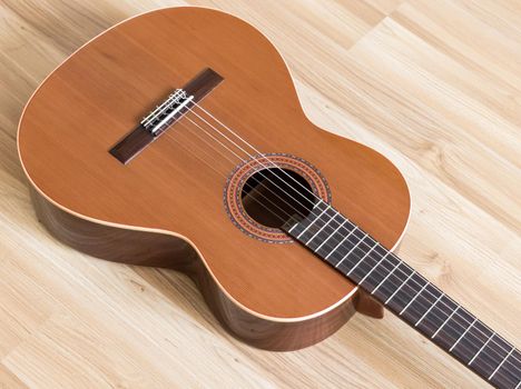 A classical guitar with six nylon strings