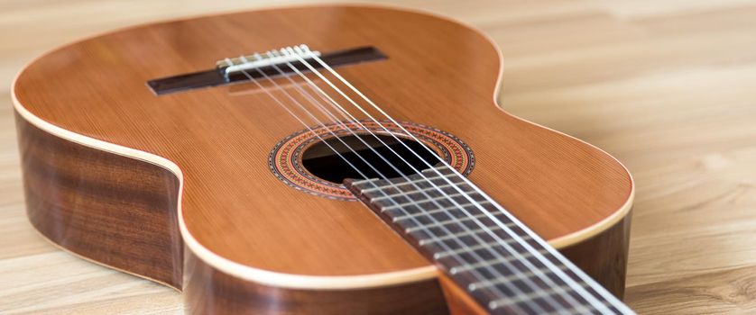 A classical guitar with six nylon strings