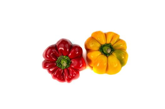 pair of yellow and red peppers on a white background