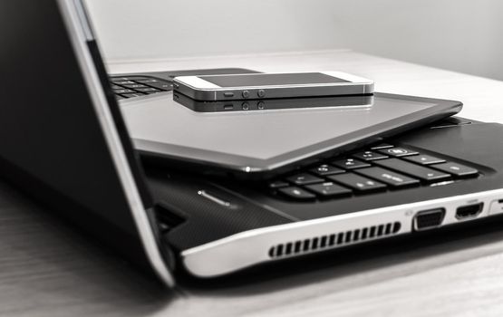 Modern electronic devices - laptop, tablet and telephone