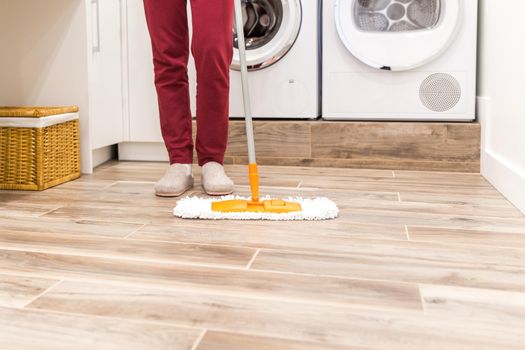 Cleaning floor in laundry room