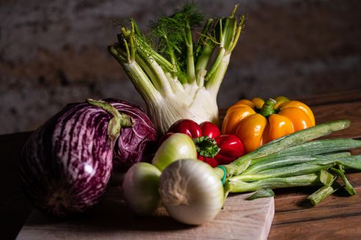 composition of vegetables with cutting board on wooden surface