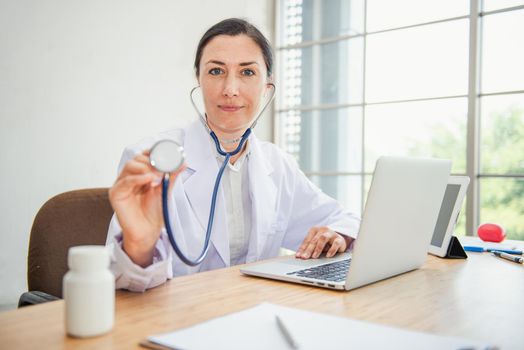 Medical Doctor is Examining Patient Health With Stethoscope in Hospital Examination Room, Female Physician Doctor is Diagnosing Physical Health Check Up for Patients. Medicine/Healthcare Concept