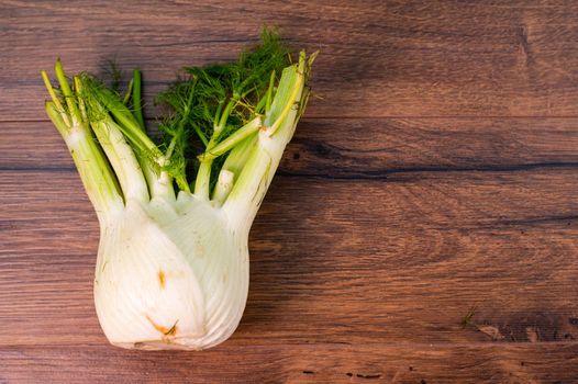 green and white fennel vegetable on wooden countertop