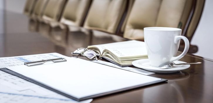 Business papers in conference room before meeting in office