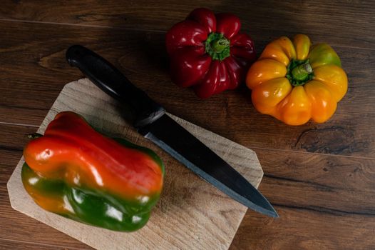 composition of vegetables with bark and cutting board on a wooden surface