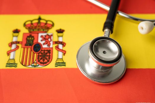 Black stethoscope on Spain flag background, Business and finance concept.
