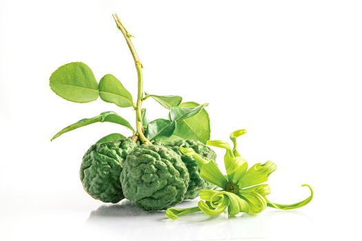 Fresh bergamot fruit or kaffir lime with cut in half on wooden background.