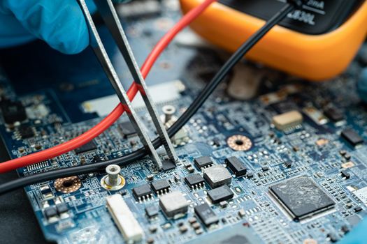 technician repairing inside of hard disk by soldering iron. Integrated Circuit. the concept of data, hardware, technician and technology.