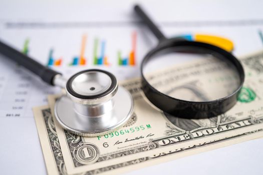 Stethoscope on chart graph paper, finance, account, statistic, analytic economy Business concept.